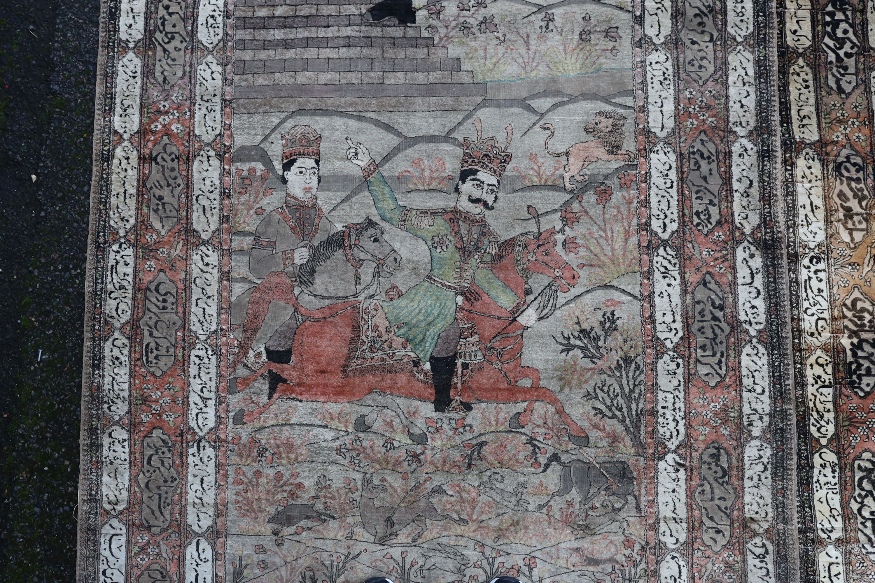 A pair of late 19th/ early 20th century Kashan silk pictorial rugs, woven with nobleman over hunters on horseback. 220 x 130cm.